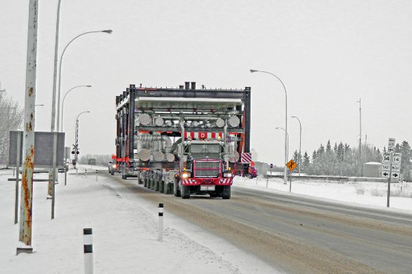 Truck shipping oversized freight on highway